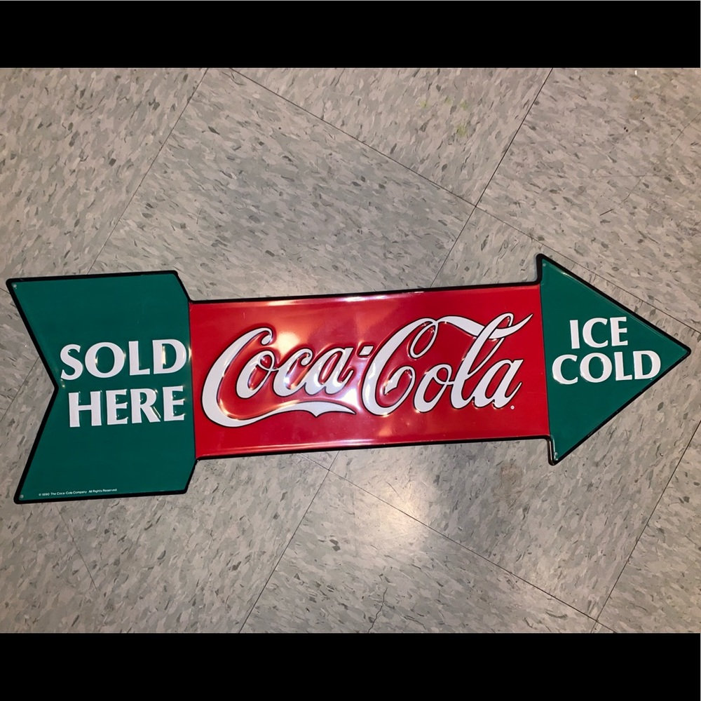 1990 Coca-Cola arrow sign